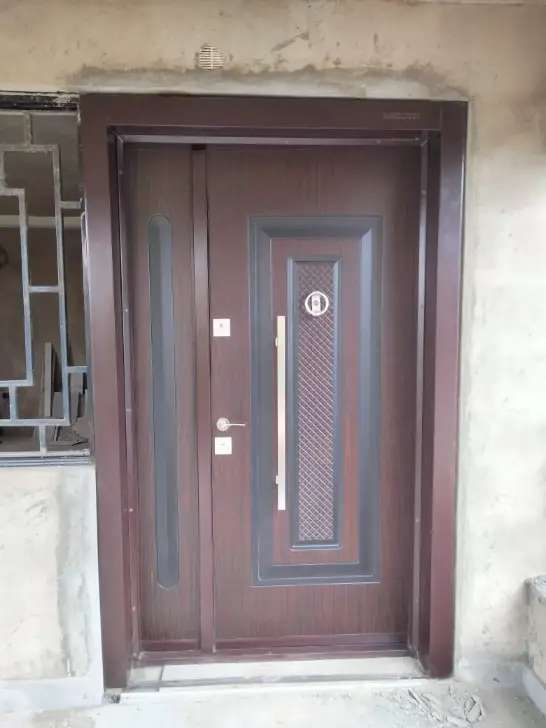 Full solid African walnut design steel door installed in Nakuru, Kenya