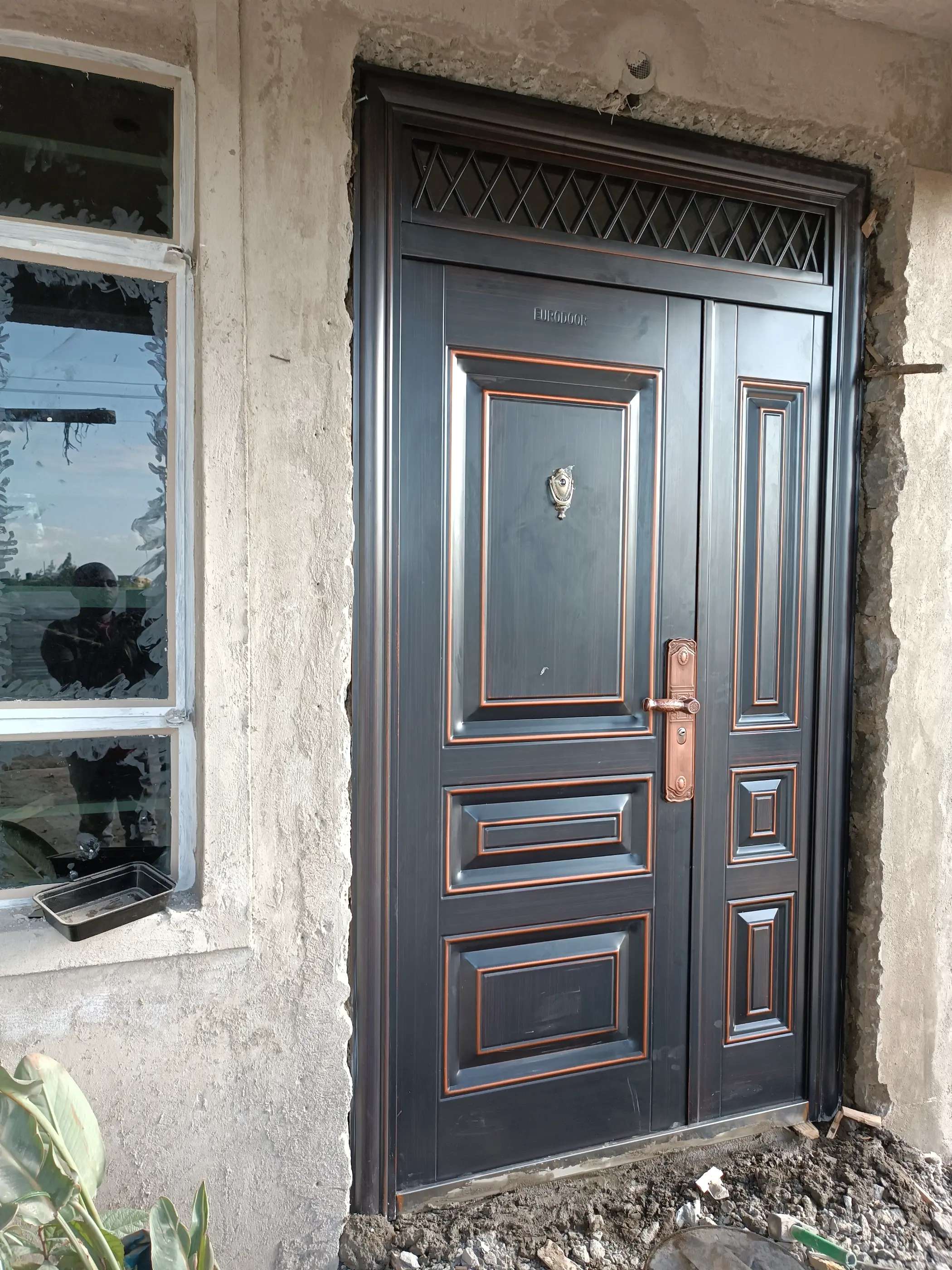 brownish double metal door installed in a  home in KENYA