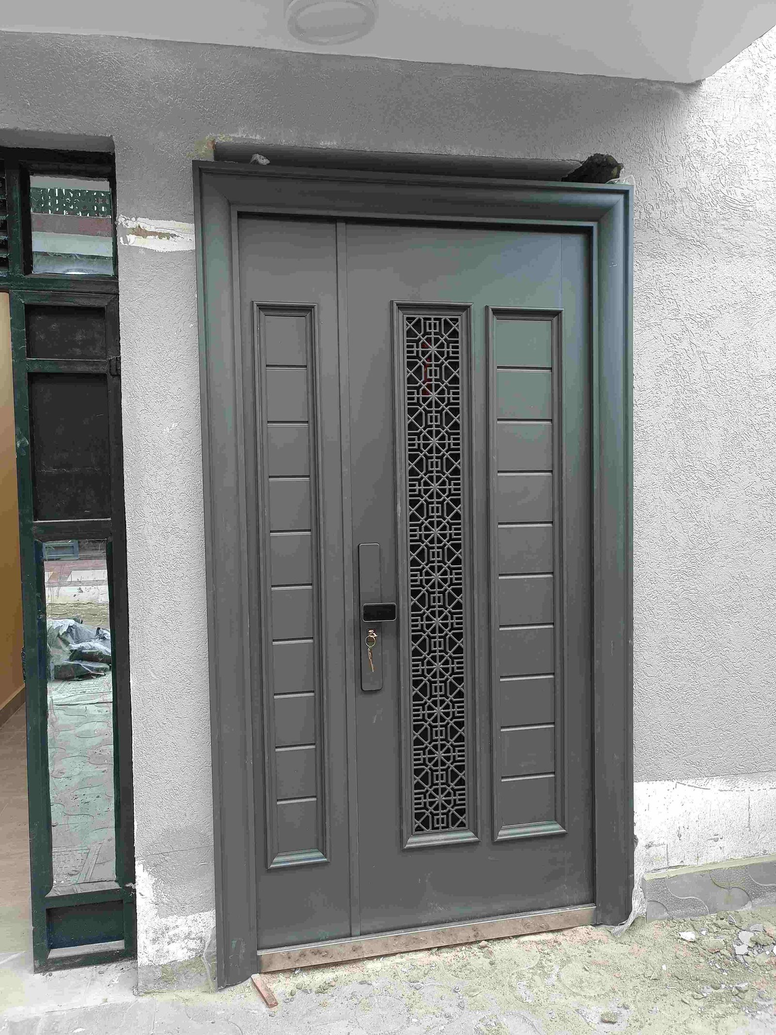 grey metal door installed in Kenya