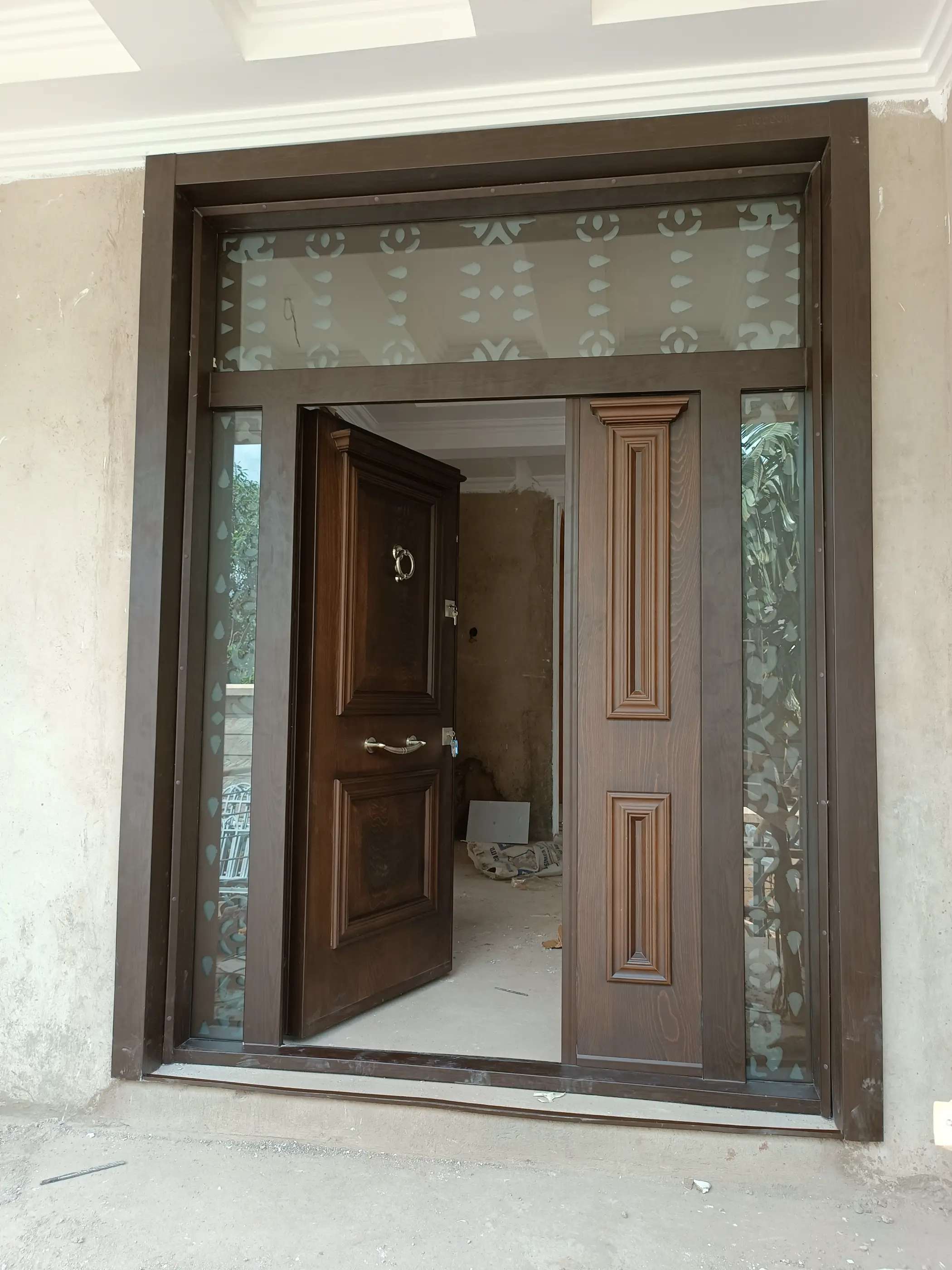 very wide 8 feet luxury double panel door  with glass on both sides and at the top installed in Runda estate in Kenya