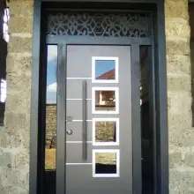 5 feet wide luxury steel door with 5 glass panes on the front installed in a luxury mansion
